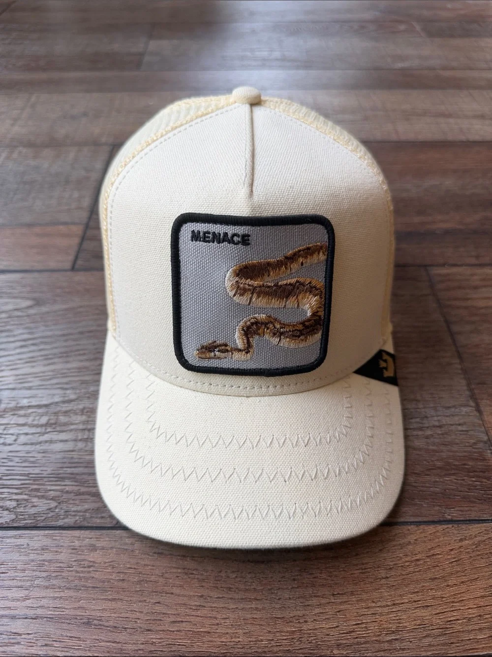 Goorin Bros Cream Trucker Hat with Brown Snake Patch
